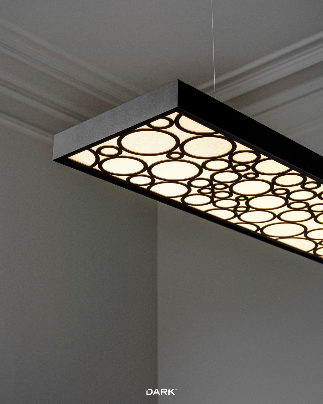 VIDRYA — a linear pendant that balances clean architecture with a bold graphic signature. 
Choose your finish (Black / White / Bronze Dark) and your pattern  to match the mood—minimal, playful, or textured. If you’re designing an office, studio, or collaborative space and want a fixture that’s both calm on screen and strong in identity—VIDRYA is a solid pick.

#darkbe #darklighting #interiordesign #design #designverlichting #ikkoopbelgisch #belgischmerk #belgiandesign #interieurdesign #interiordesign #productdesign #designlighting #lighting #verlichting #wealllovethedark